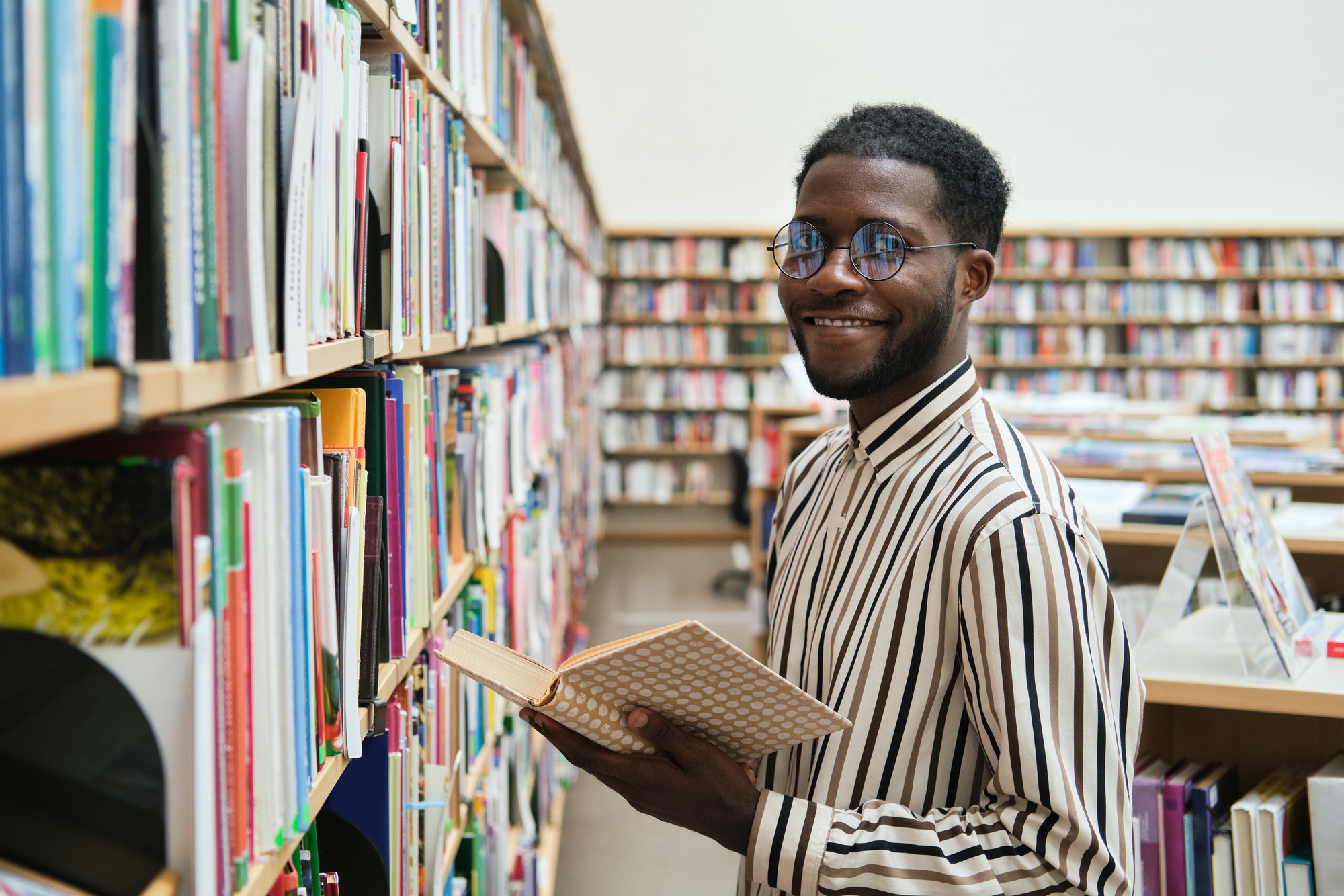African student in the library